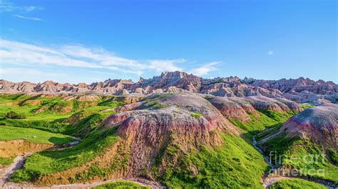 Grasslands and Colorful Eroded Rock in the Badlands Photograph by Bobby Griffiths | Fine Art America