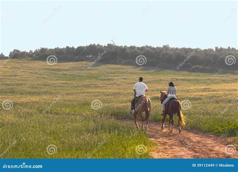 Two Riding on the Sunset editorial stock image. Image of sunset - 39112449