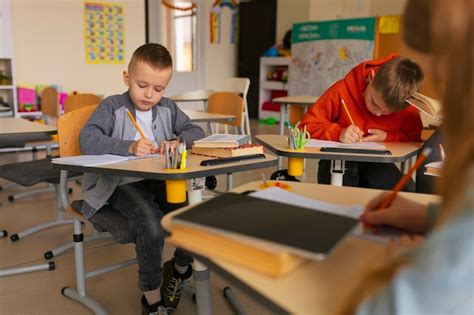 Premium Photo | Side view kids learning at school