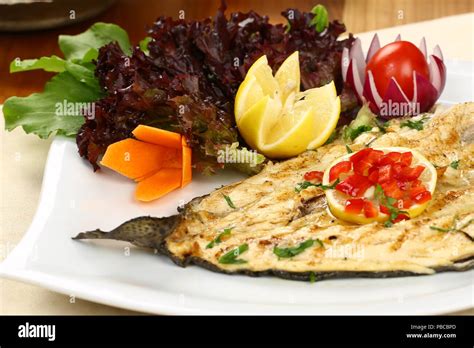 Grilled fish with vegetables Stock Photo - Alamy