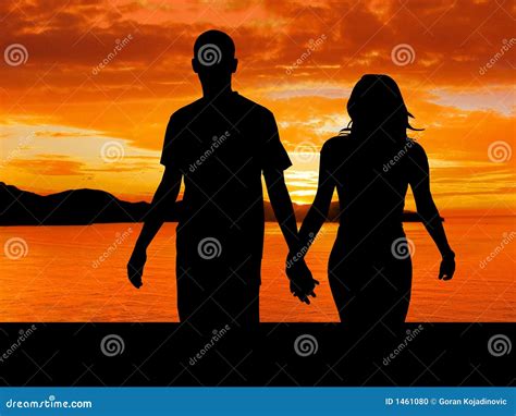 Couple walking in sunset stock photo. Image of walking - 1461080