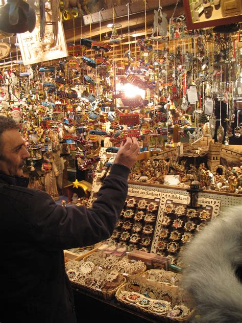 A booth selling miniature tin toy ornaments for the tree at the Nuremberg Christmas market ...