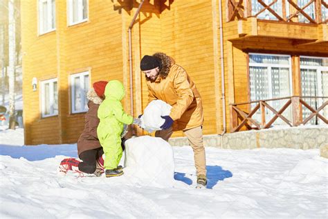 Family Building Snowman - Stock Photos | Motion Array