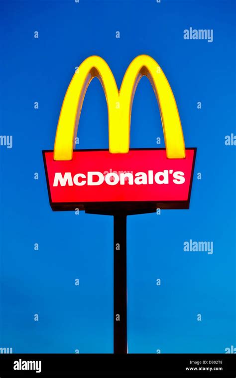 Mcdonald's Logo arches sign against a clear blue sky UK Stock Photo - Alamy