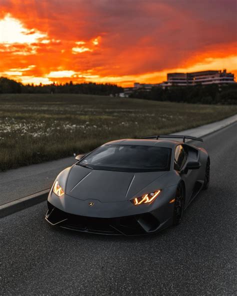 Luxury Sports Car Driving at Sunset