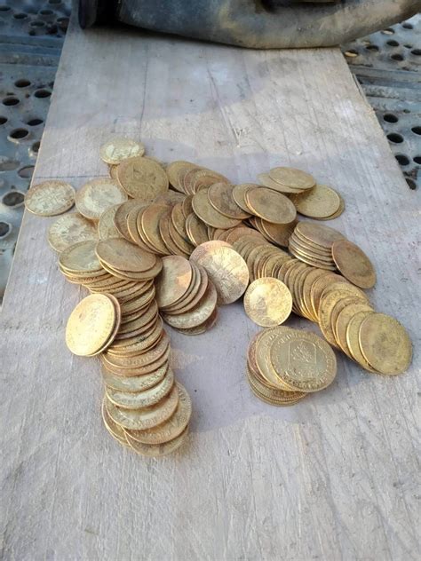 A Dream Come True: Craftsmen Discover Hidden Treasure of Gold Coins ...