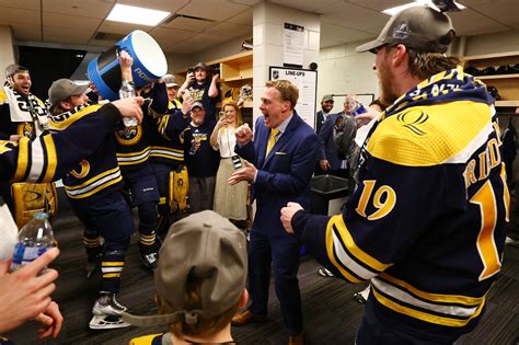 Quinnipiac hockey coach Rand Pecknold, ESPN reporter hug in interview