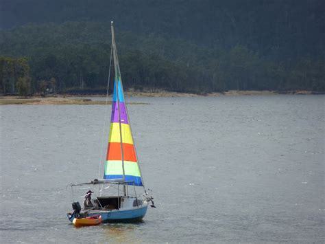 Free Image of Small sailboat towing a dinghy | Freebie.Photography