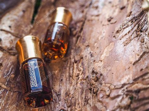 Arabian oud attar perfume or agarwood oil fragrances in mini bottle. — Stock Photo ...