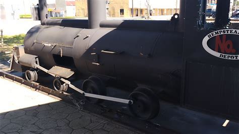 Depot City Park Hempstead Texas pavilions BBQ Grill barrels inside a small train historic ...