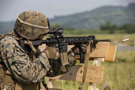 OCT 18, 2019 U.S. Marine fires an M27 Infantry Automatic Rifle while participating in a live ...