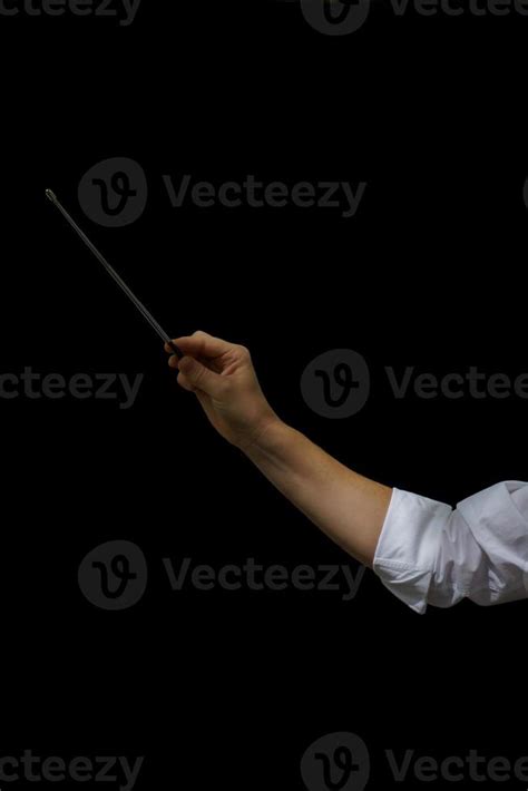 arm of an orchestra conductor holding a baton 11413396 Stock Photo at ...