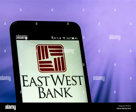 East West Bank logo seen displayed on a smart phone Stock Photo - Alamy