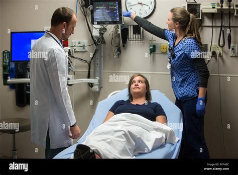 Emergency Room doctor and nurse with patient at hospital Stock Photo ...