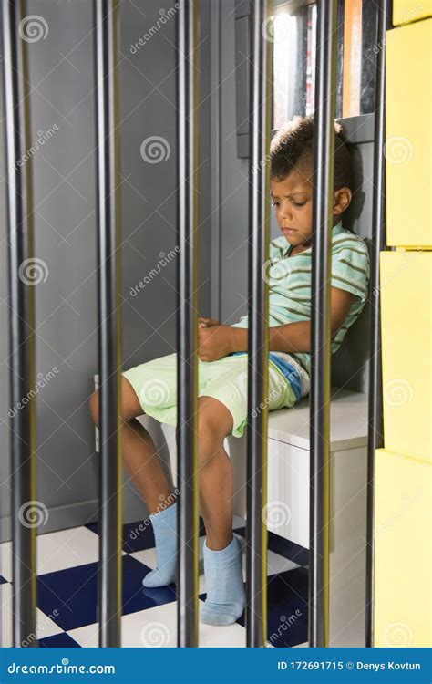 Kid Prisoner Try To Escape from Jail. Stock Image - Image of person, childhood: 172691715