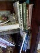 Group of coffee table books, shell, glass candle stands, candles, more. - Bid-Assets Online Auctions