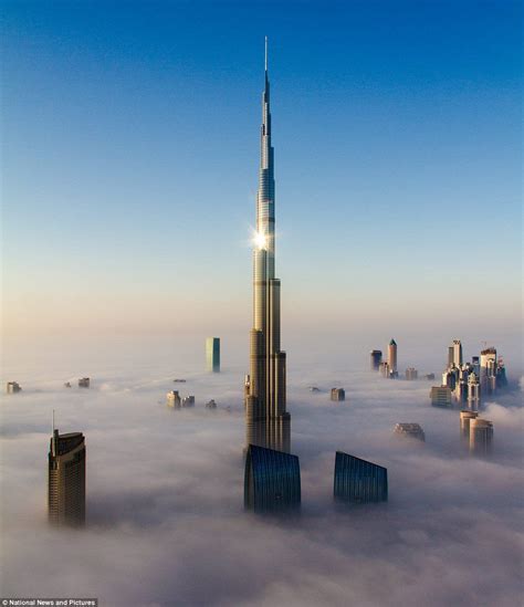 Rising about the clouds: The world's tallest building peaks above the ...