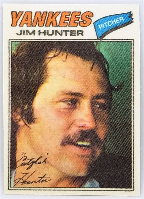 an autographed baseball card with a man's face