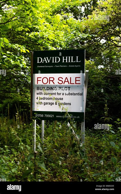 A for sale sign showing the sale of a plot of land with planning ...