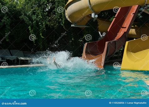 Incident on the Water Slide Stock Photo - Image of family, play: 110526856