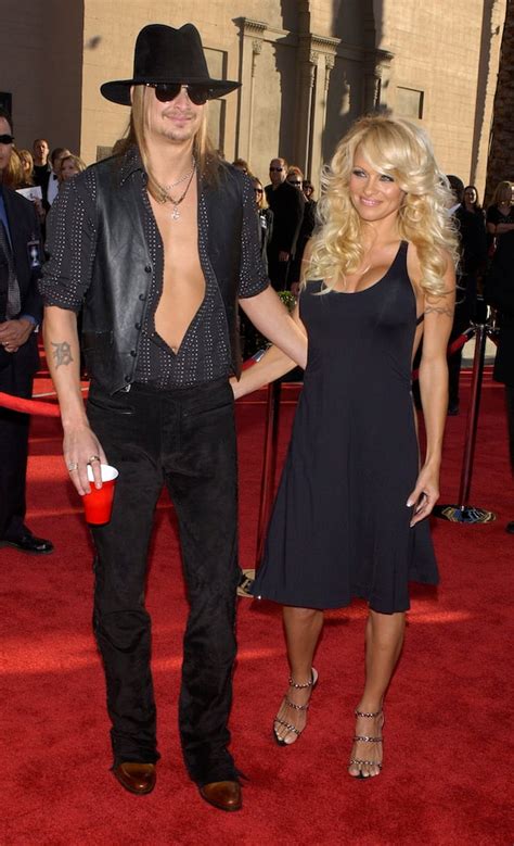 Kid Rock (L) and girlfriend Pamela Anderson arrive at the 31st annual American Music Awards in ...