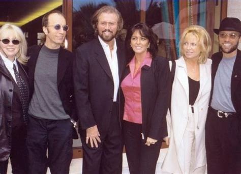 the bee gees with their wives Dwina, Linda, and Yvonne | Bee gees, Gees, Andy gibb