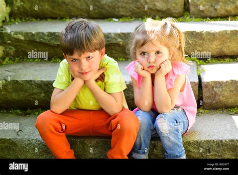 small girl and boy on stairs. Relations. summer vacation. childhood ...