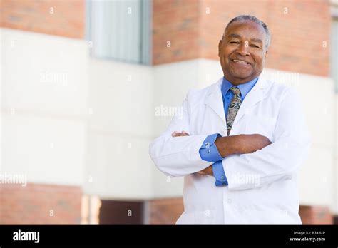 Doctor Standing Outside A Hospital Stock Photo - Alamy