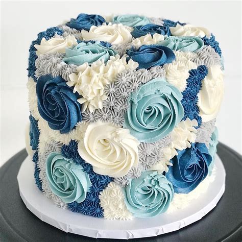 Our blooming buttercream cake is stunning in different shades of blue! 💙 | Creative cake ...