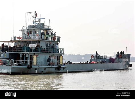 Rohingya refugees board a Bangladesh Navy ship to be transported to the ...