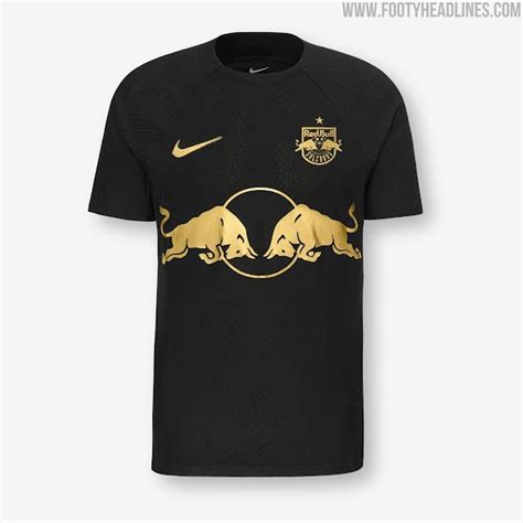 a black and gold shirt with two bulls on it's chest, in front of a ...