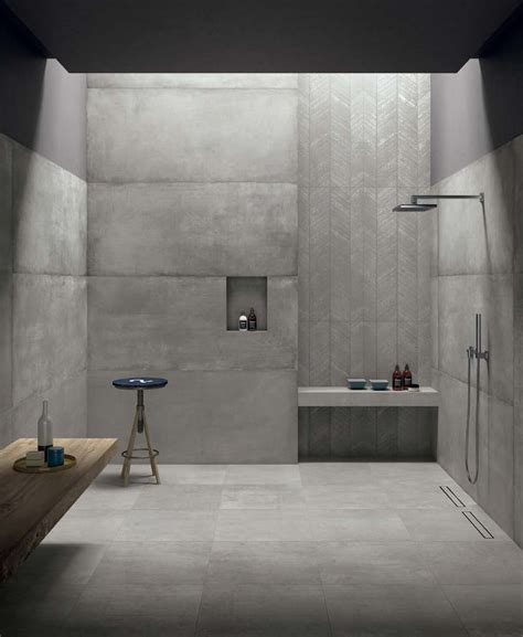 This modern grey bathroom has a cement look porcelain tile called Cemento 24"x24" on the floors ...