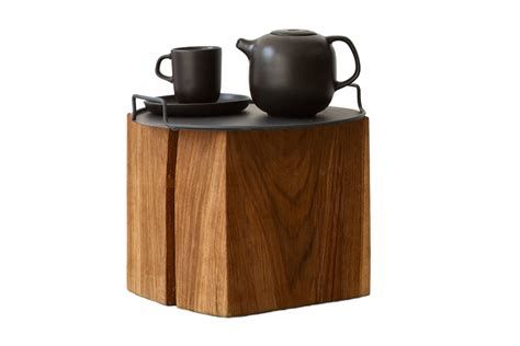 Brown wooden side table with black plate, cup and teapot isolated on a transparent background ...
