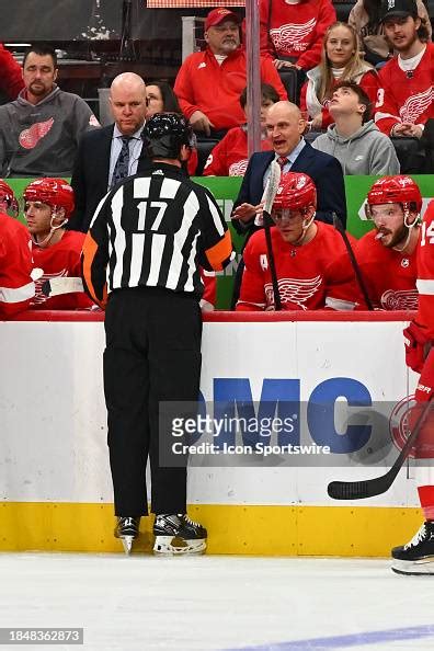 Detroit Red Wings head coach Derek LaLonde talks with referee... News ...