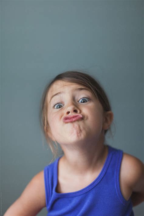 "Simple Indoor Portrait Of Young Girl Making A Silly Face" by Stocksy Contributor "Amanda ...