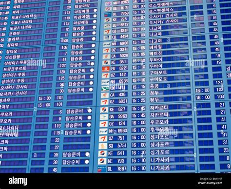 Flight departure board in Korean, Incheon International Airport ...