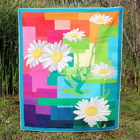 This Beautiful Quilt Makes a Big Impression | Rainbow quilt, Flower quilts, Colorful quilts