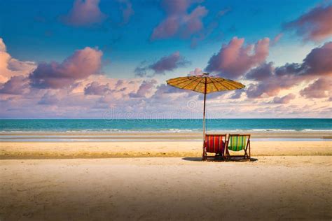 Beach Chairs on the Sand Beach with Dramatic Sky at Sunset Stock Photo - Image of rest ...