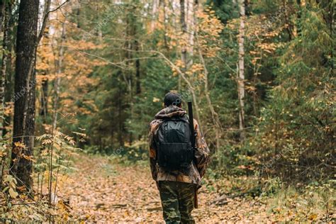 Man hunter in forest — Stock Photo © Scharfsinn #120076970