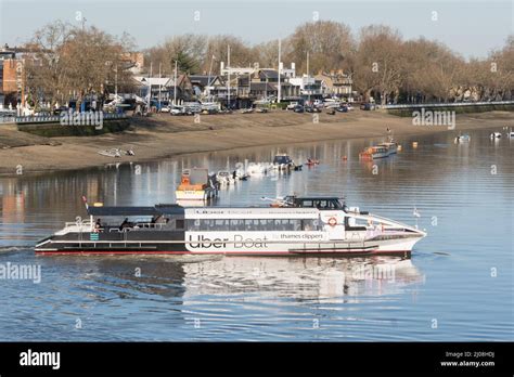 A Uber Boat Thames clipper departing Putney Pier, Putney, southwest London, England, UK Stock ...