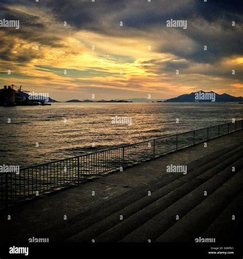 Golden sunset over the ocean Stock Photo - Alamy