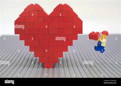 Assemble of red heart in valentines day on lego floor Stock Photo - Alamy