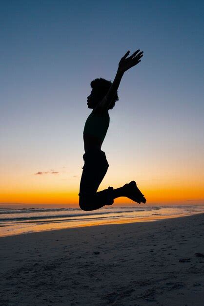 Premium Photo | Full shot silhouette jumping at sunset