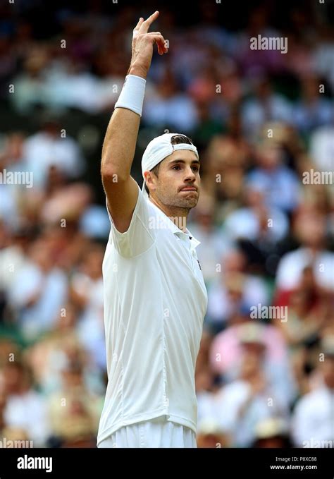 John Isner encourages the crowd on day eleven of the Wimbledon ...