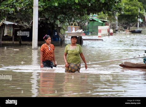 Kalay, Myanmar. 3rd Aug, 2015. Local residents wade through a flooded ...