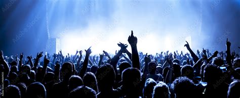 cheering crowd at a rock concert Stock Photo | Adobe Stock