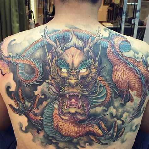 Badass Dragon Tattoos | TAM Blog | Dragon tattoo, Back tattoos for guys ...