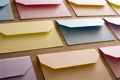 Rows of open pastel colored envelopes Creative Commons Stock Image