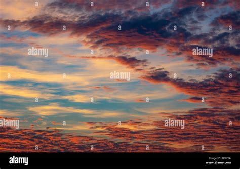 Colorful afterglow sky background with clouds Stock Photo - Alamy