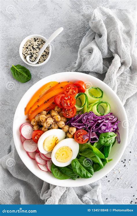 Buddha Bowl Salad with Chickpeas, Sweet Pepper, Tomato, Cucumber, Red Cabbage Kale, Fresh Radish ...